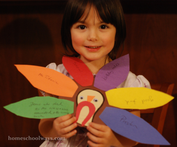 Little girl with Thanksgiving turkey craft