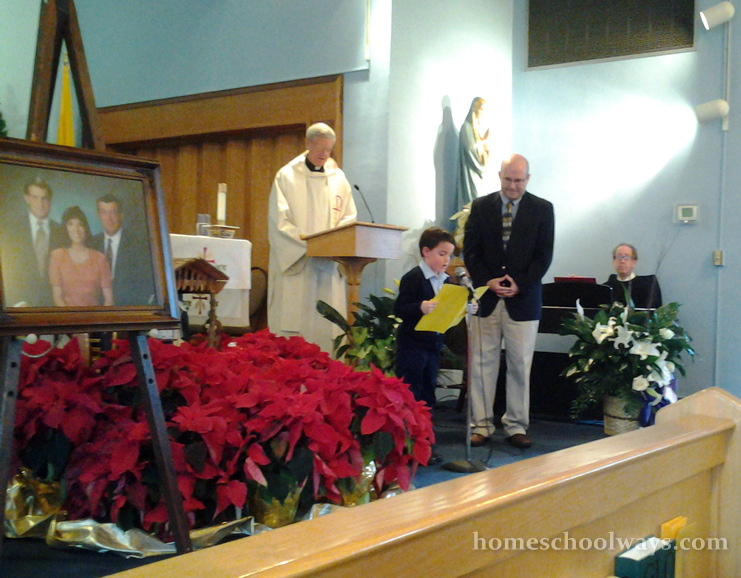 Six-year-old boy reading Psalm 23 at his grandfather's memorial service in a catholic church