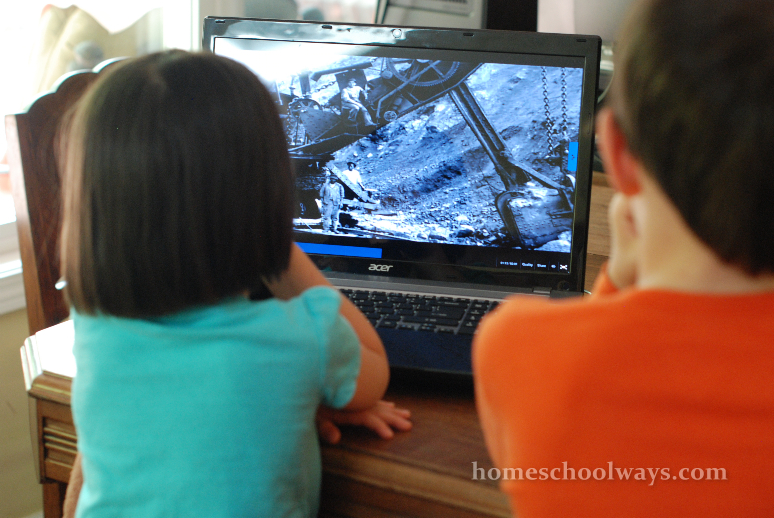 Children watching a documentary about steam shovels