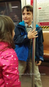 Boy and girl riding the DC Metro