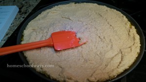 Chickpea paste spread in a pizza pan for cecina