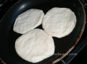 Biscuit dough frying in a pan