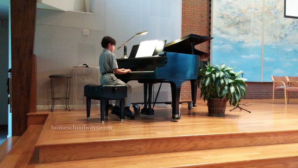Boy playing piano in church