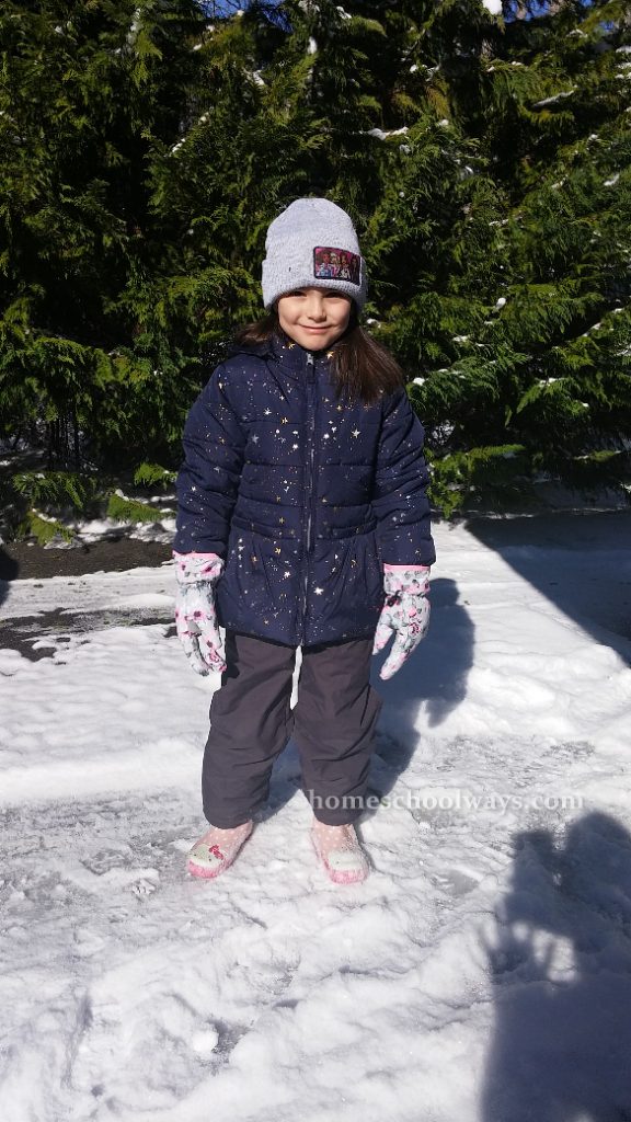 Girl dressed to play in snow
