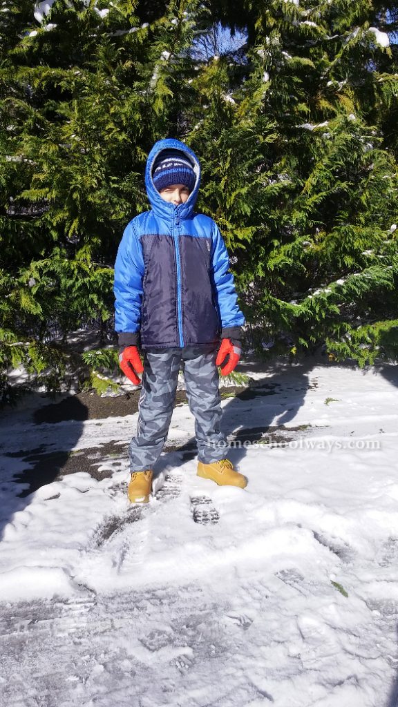 Boy dressed to play in the snow
