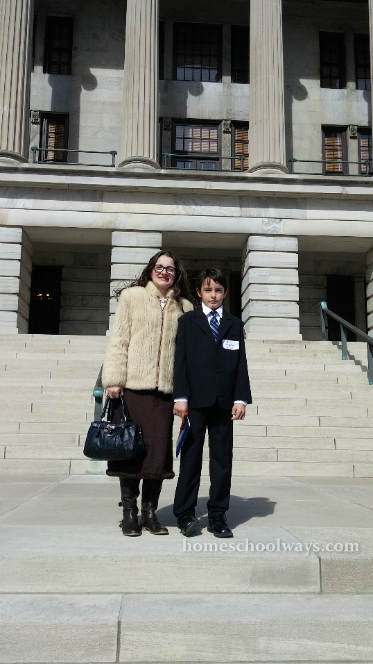 Mom and son in front of the Tennessee Capitol Building in Nashville.