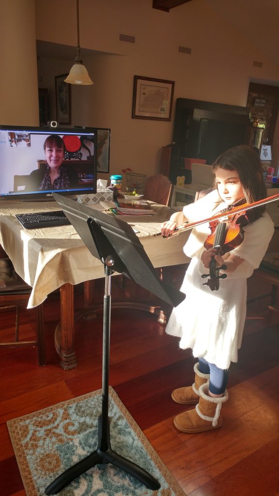 Girl taking Skype vioiin lesson