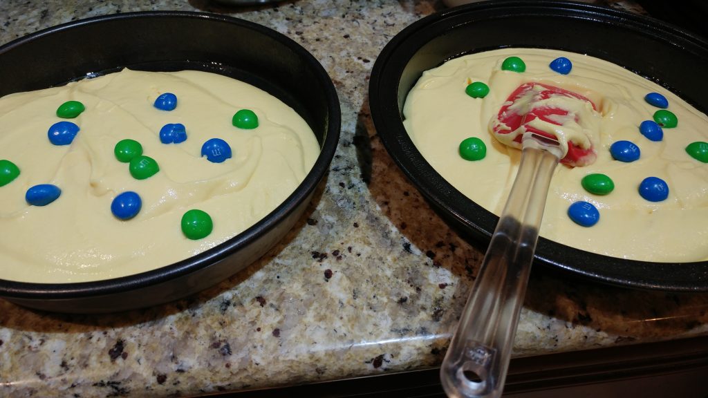 Two sides of cake with peanut butter M&Ms