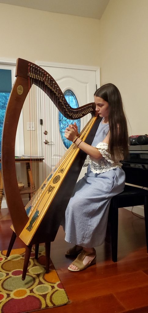 Girl playing folk harp